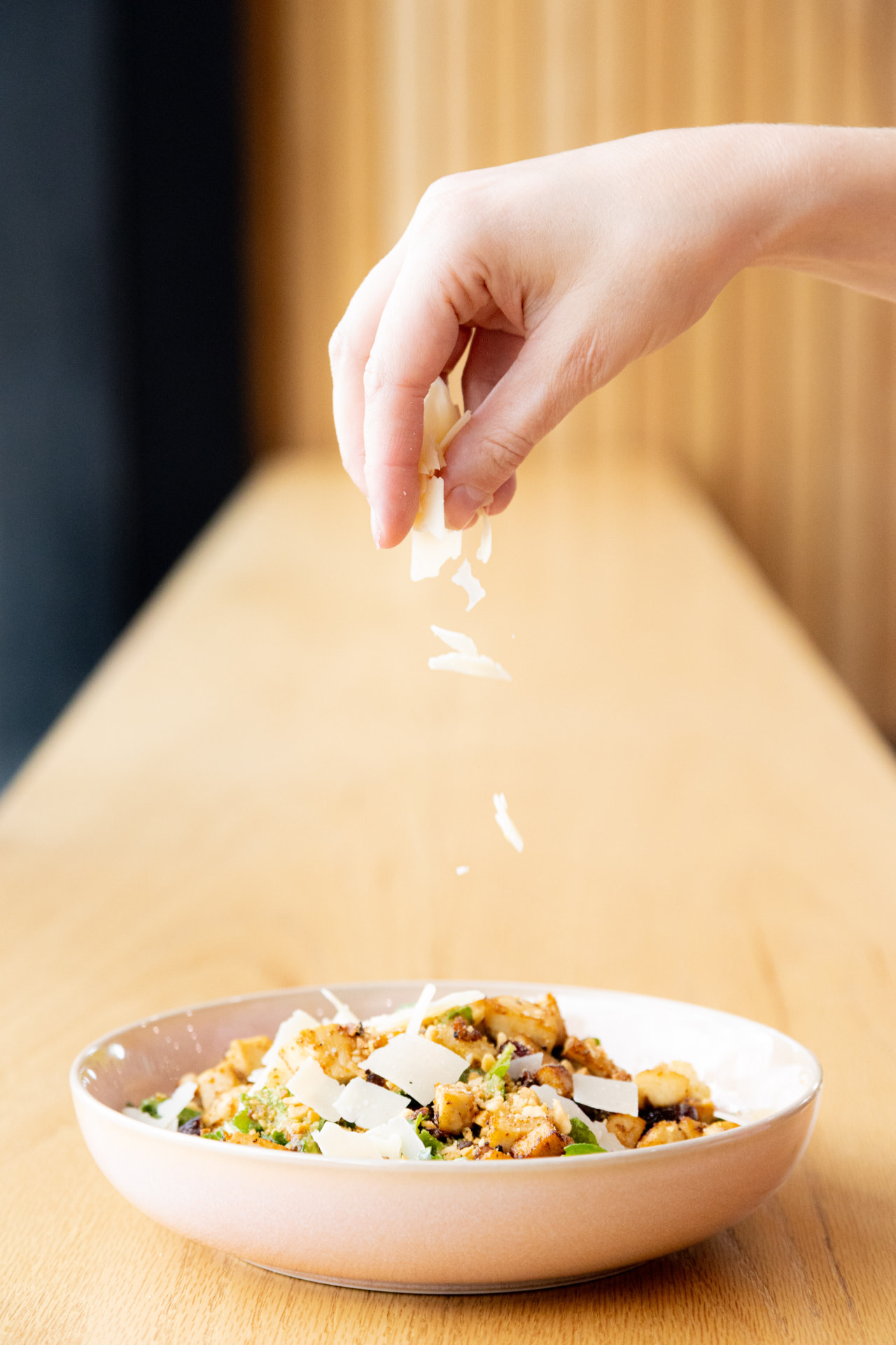 Fresh DUO café salad finished by hand with shaved cheese
